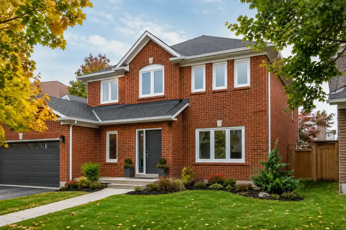 Red-brick Newmarket home with replacement windows and a dark fiberglass entry door