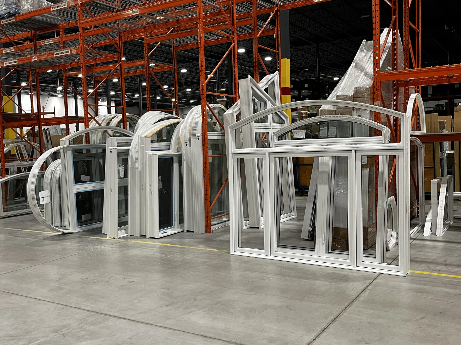 Custom arched and shaped vinyl windows at the window manufacturing facility