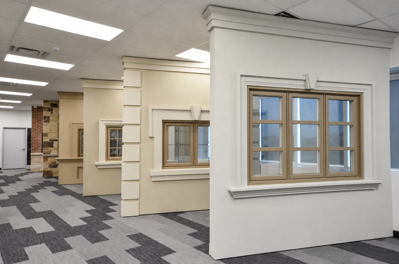 Window frame colours and decorative grid designs displayed in the showroom